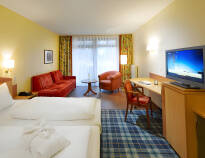 The spacious hotel rooms offer a view of the greenery or the lake.