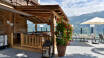 The hotel's terrace offers views of the Zillertal Valley and refreshments.