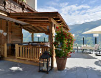 The hotel's terrace offers views of the Zillertal Valley and refreshments.
