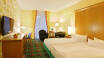 The spacious and comfortably furnished rooms invite you to stay.