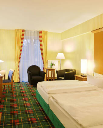 De romslige og komfortabelt møblerte rommene inviterer deg til å bli.