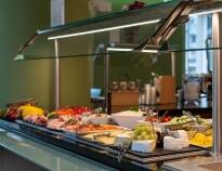 Start your day with a nutritious breakfast buffet featuring fresh juices, scrambled eggs, and gourmet coffee.