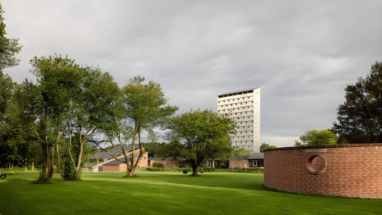 Stay in a heritage-listed former folk high school showcasing iconic Danish 1960s architecture and original design details.