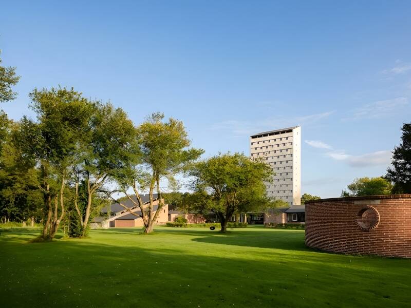 Stay in a heritage-listed former folk high school showcasing iconic Danish 1960s architecture and original design details.