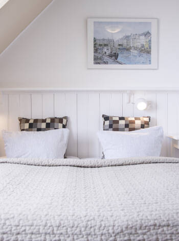 Die Zimmer des Hotels Klostergaarden haben den Charme eines authentischen Ferienhotels bewahrt und verbinden Geschichte mit Komfort für einen unvergesslichen Aufenthalt.