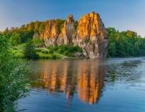 Take a tour to see the famous rock formation Externsteine in the Teutoburg Forest.