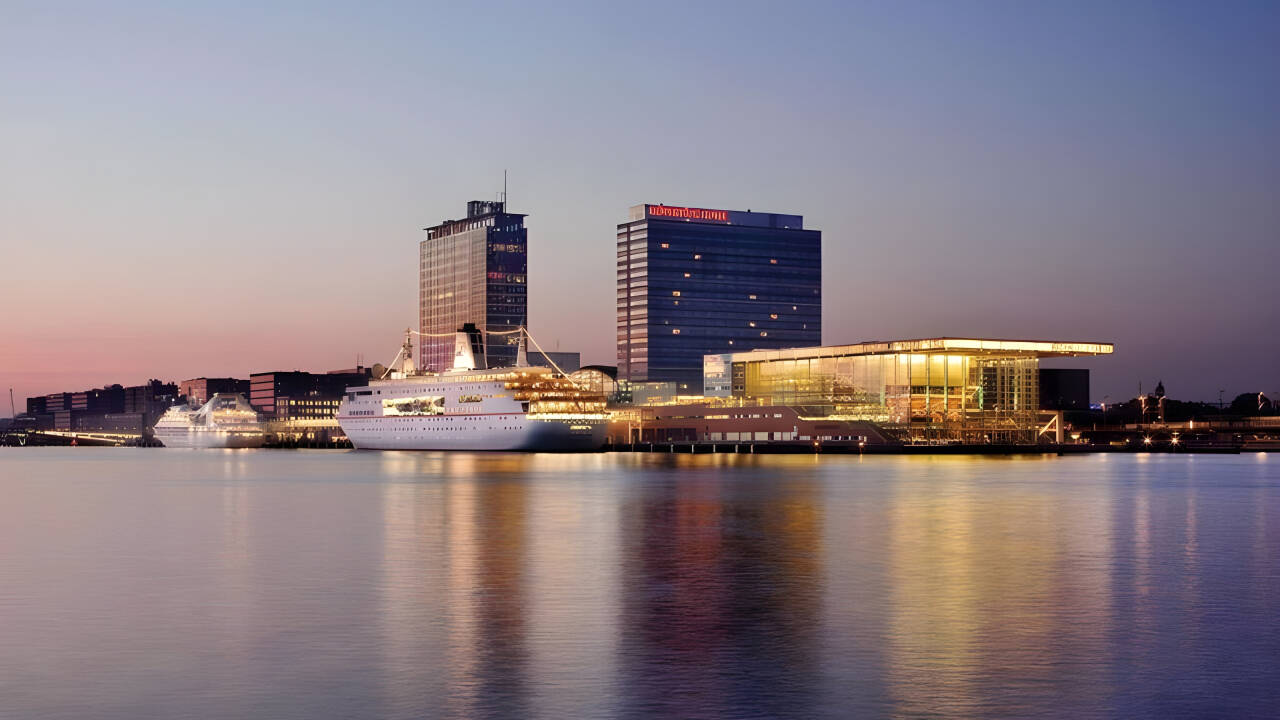 Prime waterfront location offers city and river views for a scenic Amsterdam stay.