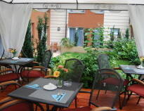 The breakfast area features a garden terrace, where you can enjoy your start of the day and a sumptuous breakfast.