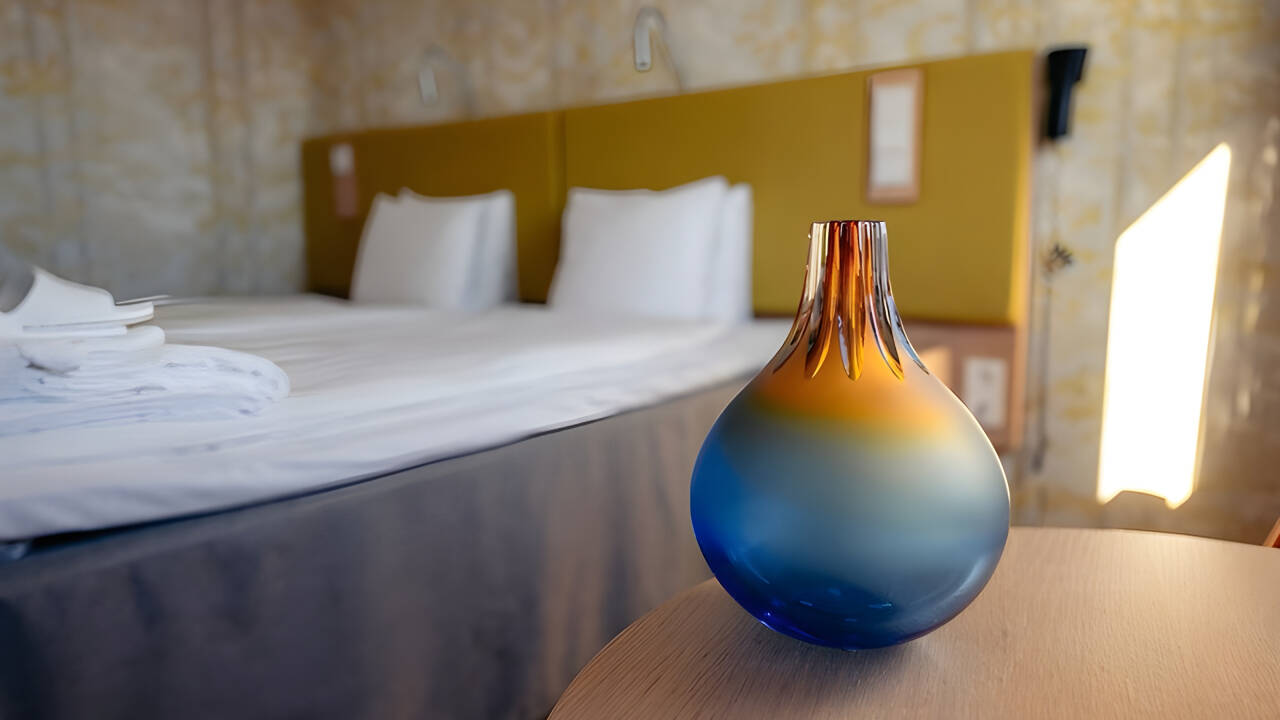 Sleep surrounded by original Kosta Boda glass art in individually designed rooms.