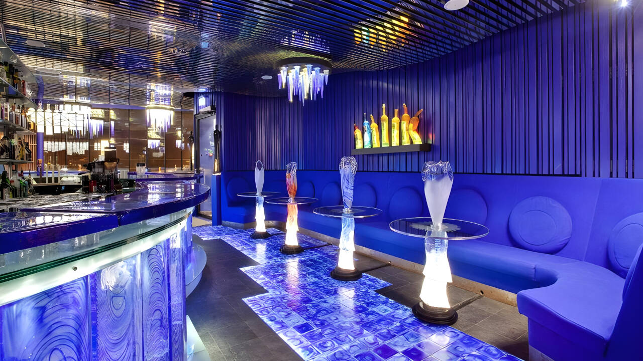 The cobalt-blue bar is more than a place for a drink—it's one of the hotel's most iconic works of art.