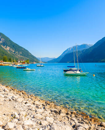 Explore the crystal-clear waters of Achensee, just a short drive from the hotel.