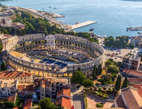 You'll stay just outside the town of Pula, where you can shop and discover the history of the city.