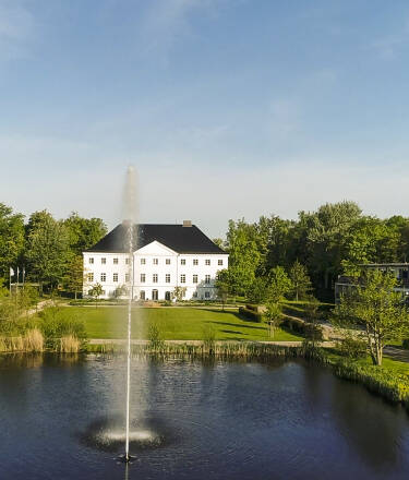 Surrounded by lush greenery and tranquil ponds, Schlossgut Gross Schwansee offers a serene escape with opportunities for nature walks and bathing.