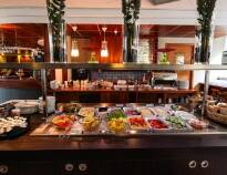 The hotel bistro offers a buffet breakfast with a selection of yoghurt, bread and cold cuts.