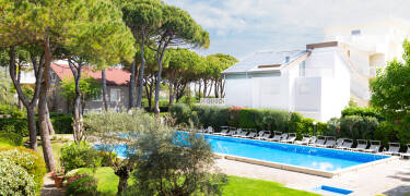 Relax by two pools, surrounded by lush gardens and maritime pines.
