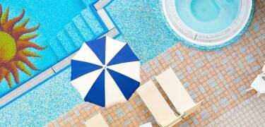 Unwind in the spa with indoor and outdoor pools, a spa tub, and relaxing treatments.