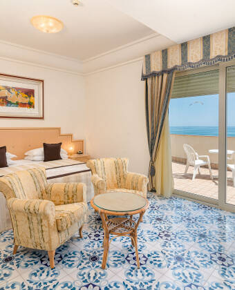Stay in elegant rooms with private balconies, mini-bars, and satellite TV for comfort.