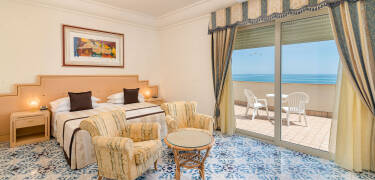 Stay in elegant rooms with private balconies, mini-bars, and satellite TV for comfort.