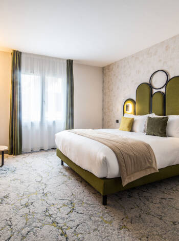 Relax in comfortable, modern, and well-equipped rooms designed for a restful stay, offering a peaceful atmosphere for complete relaxation.