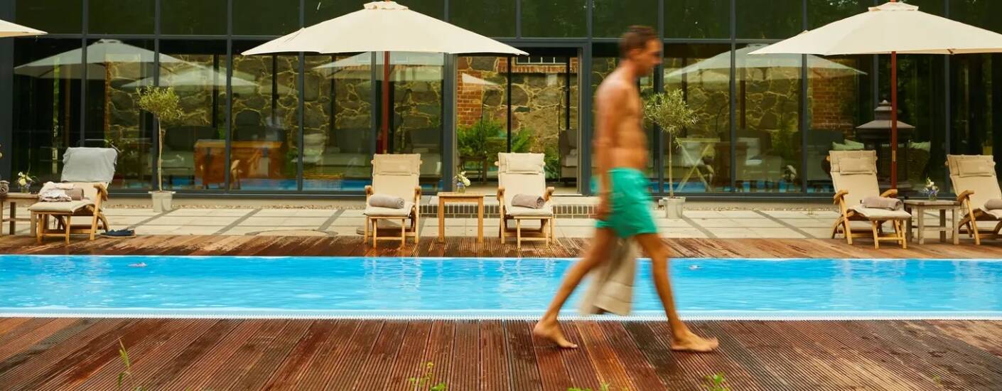 Quiet wellness lounge with sauna, heated outdoor pool, steam bath and infrared cabin