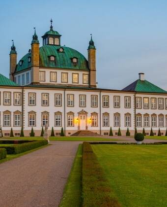 Visit Fredensborg Slot, a royal residence in the picturesque Northern Zealand.