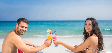 Enjoy direct access to a private beach equipped with sun loungers, umbrellas, and VIP services.
