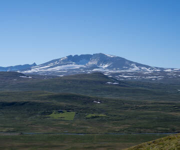 Våkn opp til en fantastisk utsikt over Snøhetta og få en uforglemmelig norsk opplevelse.