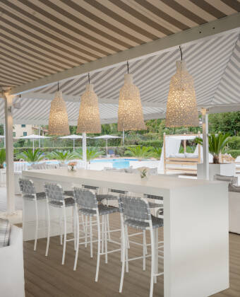 Relax with a drink by the pool – the bar serves refreshing cocktails and Italian favourites in a laid-back setting.