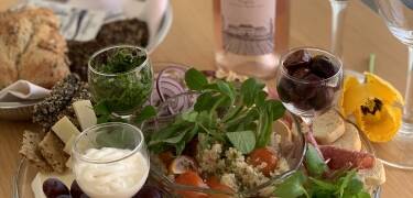 Share a tapas plate and a bottle of Rosé wine on arrival.