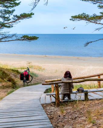 Take peaceful coastal walks through pine forests, with scenic trails leading directly to the sandy beach.