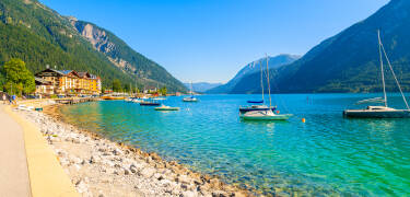 Achensee offers clear waters, mountains, and year-round activities.