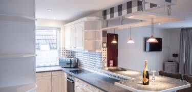 A fully equipped kitchen and dining space give you the freedom to enjoy meals on your own schedule.