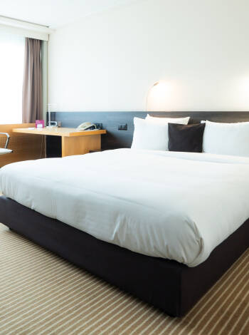 Comfortable modern rooms with premium amenities ensure a relaxing stay.