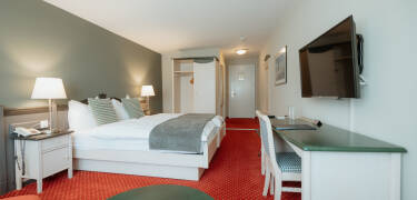 Komfortable rom gir et stille sted å slappe av etter en dag ute.