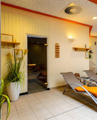 A wellness area with sauna and relaxation zone offers the perfect place to unwind.