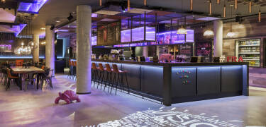 After a day of exploring Frankfurt, settle into the hotel's welcoming bar for a drink.