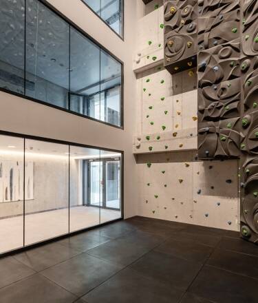 Enjoy modern sports facilities including a gym, squash courts, and a climbing wall, perfect for an active holiday.