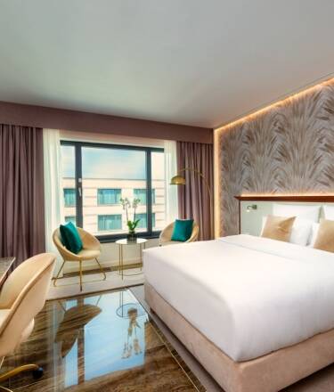 Relax in spacious rooms and suites featuring premium bedding, elegant furnishings and refined comfort.