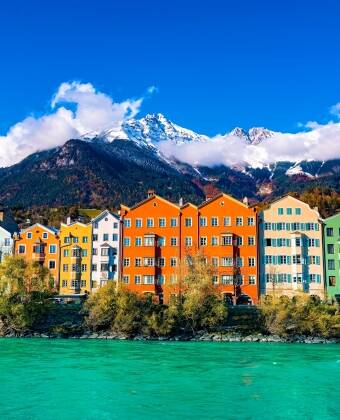 Take a day trip to Innsbruck for colorful riverside houses and historic streets.