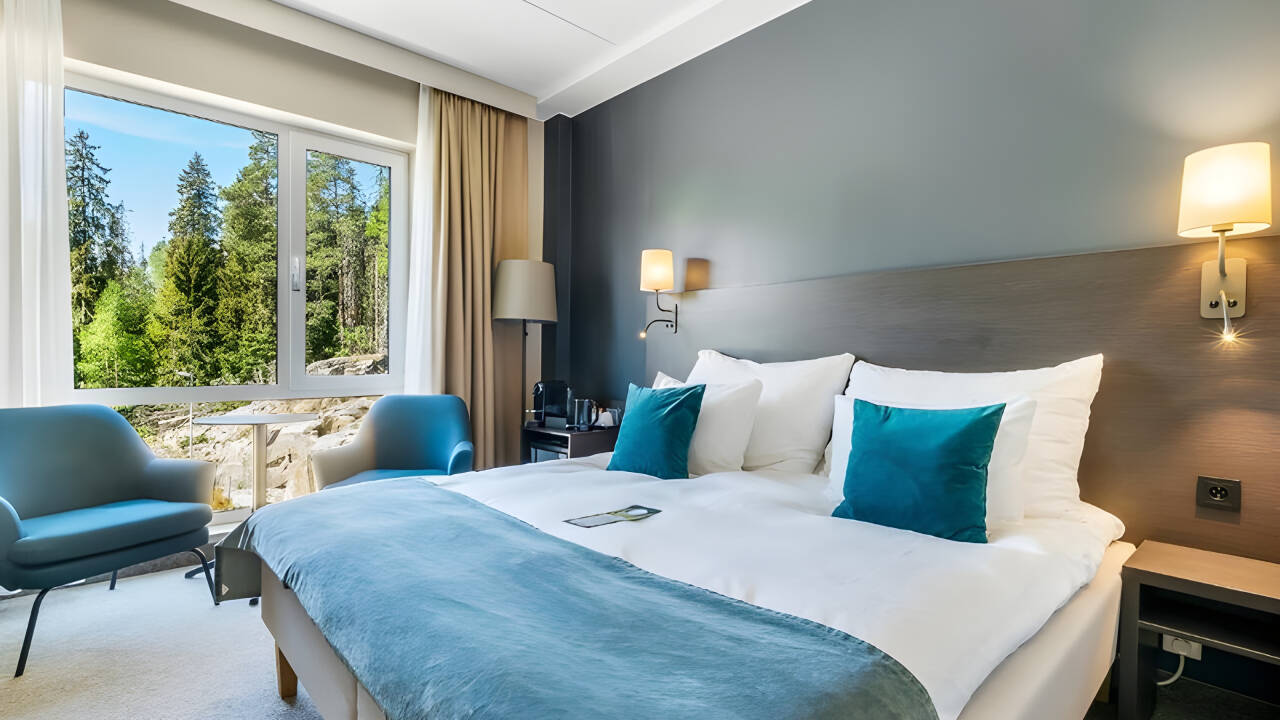 The hotel offers comfortable rooms with extra bed options.