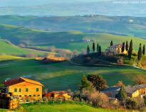Smukke Toscana har sin helt egen charme med de hyggelige gårde og det bakkede landskab.