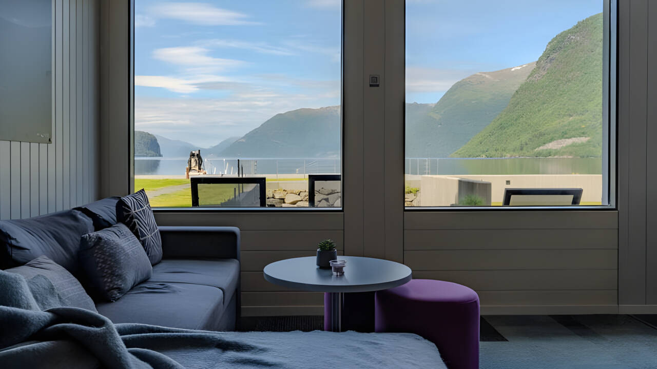 Cozy rooms with balconies offer stunning lake or mountain.