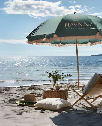 Relax at Havna Strand, a peaceful seaside retreat where sunshine, sea breezes and calm set the pace.
