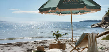 Relax at Havna Strand, a peaceful seaside retreat where sunshine, sea breezes and calm set the pace.