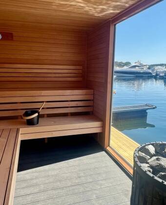 Embrace the Norwegian sauna tradition before cooling off with a refreshing swim in the crystal-clear sea.