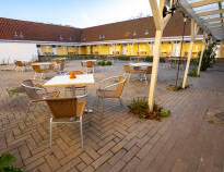 In the hotel's cosy courtyard you can enjoy a cup of coffee in the good weather