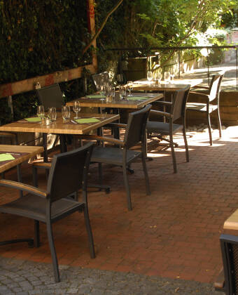 Enjoy a glass of wine on the hotel's cosy terrace, decorated with fragrant flowers.