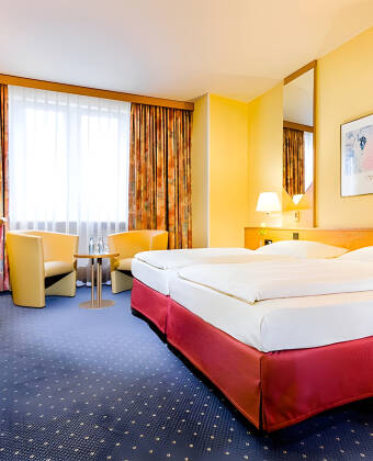 You'll stay in spacious rooms where you can get a good night's sleep after an eventful day in Dresden.