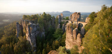 Take the drive to the fascinating cliffs with small bridges and stairs. Inside you'll find an impressive stone castle.