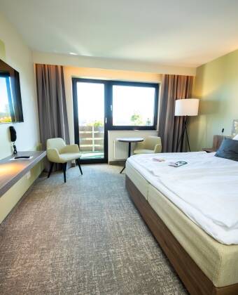 The rooms are warm and welcoming, with a fantastic view of the surrounding nature and the Weser valley.
